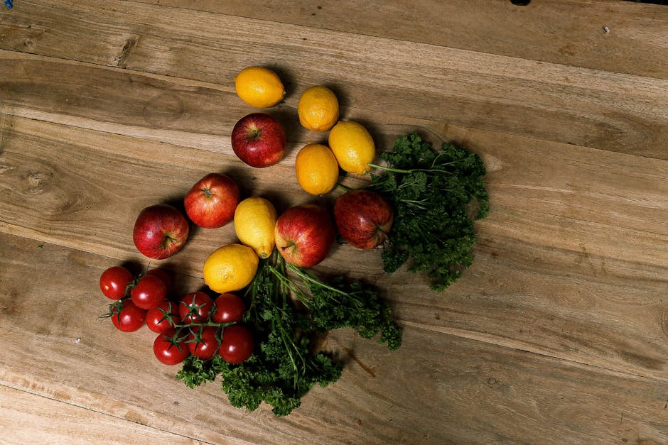 colorful fresh fruits and vegetables rich in vitamin C on wooden table