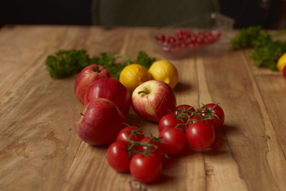 fresh fruits and vegetables rich in vitamin C on wooden table
