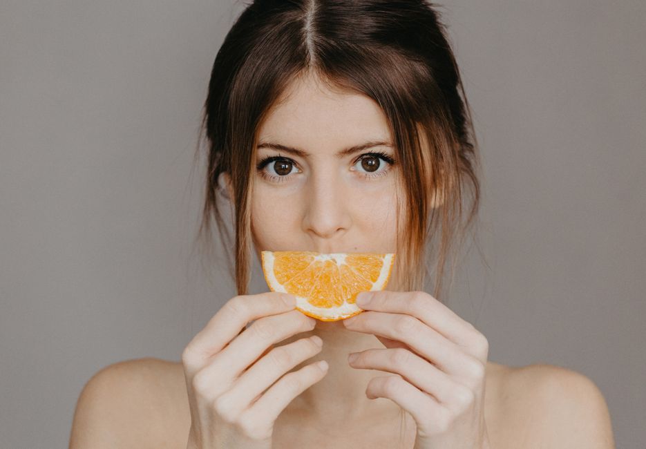 vitamin C collagen skin healthy glow woman natural light
